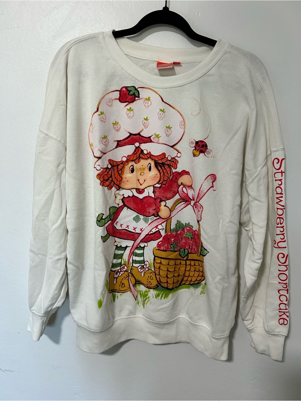 Strawberry Shortcake Crewneck Sweatshirt - Cream with Pink Tag